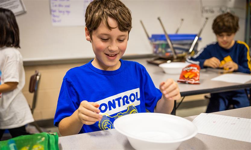 Students create compasses in science class